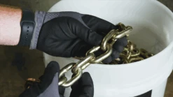 3/8" X 75' Grade 70, Yellow Chromate, Transport Chain, Pail -E-rigging Store 3 8 75 Lynx Grade 70 Yellow Chromate Transport Chain in hand